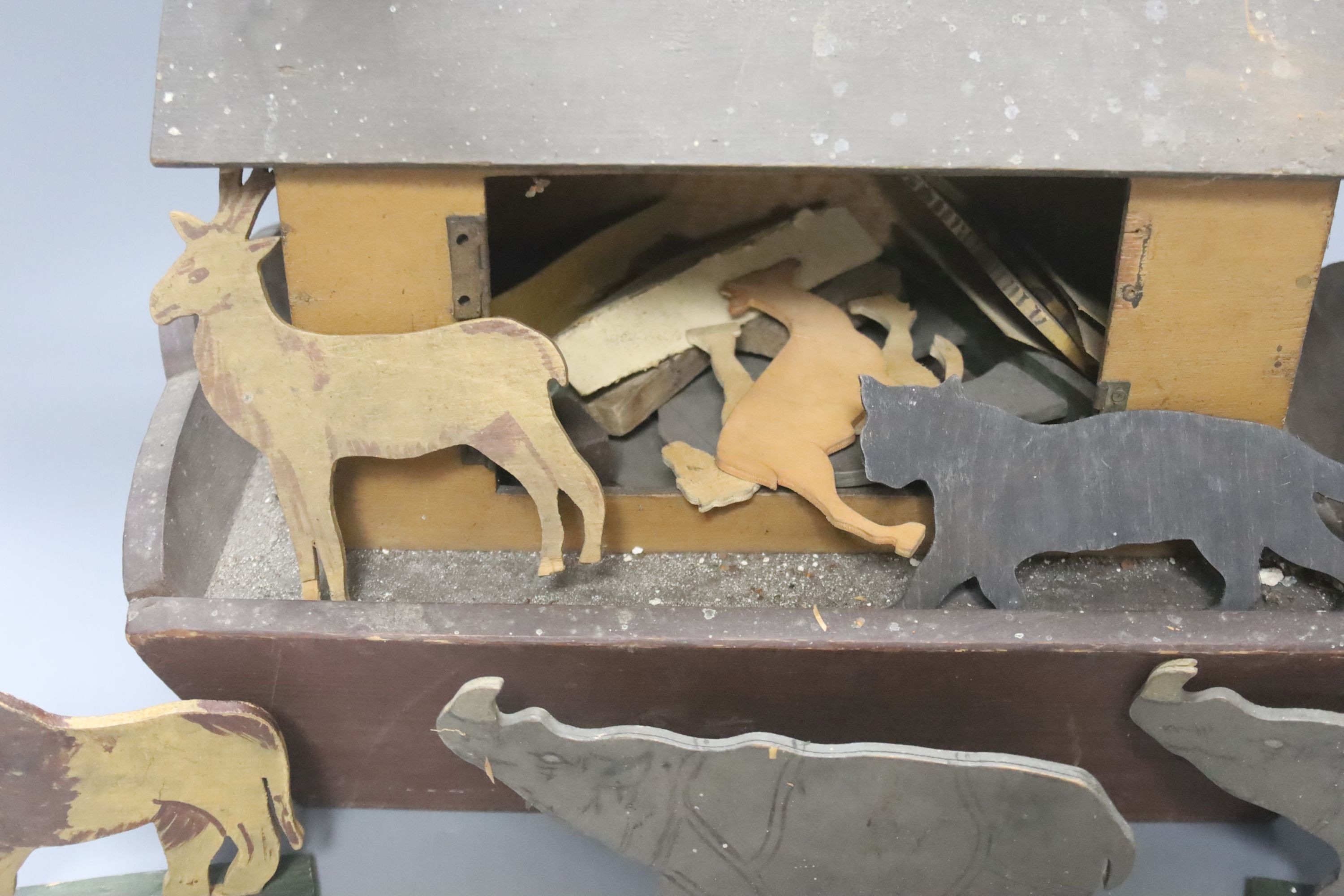 An early 20th century Steiff pull-along horse on wheels, boot button eyes and wood wool filling, button in left ear, 40cm long and a late 19th century painted plywood Noah's Ark with animals